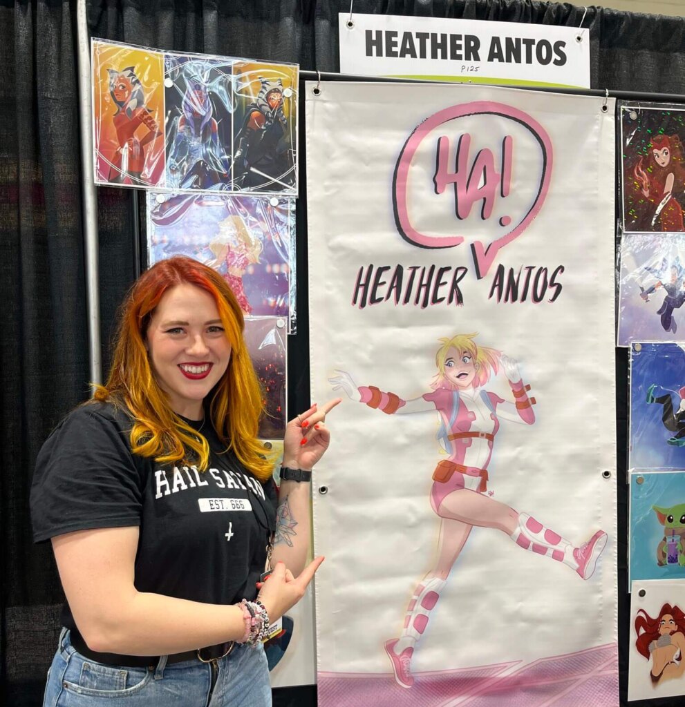 Heather Antos posing with her artwork for Gwenpool at Toronto Comicon 2024