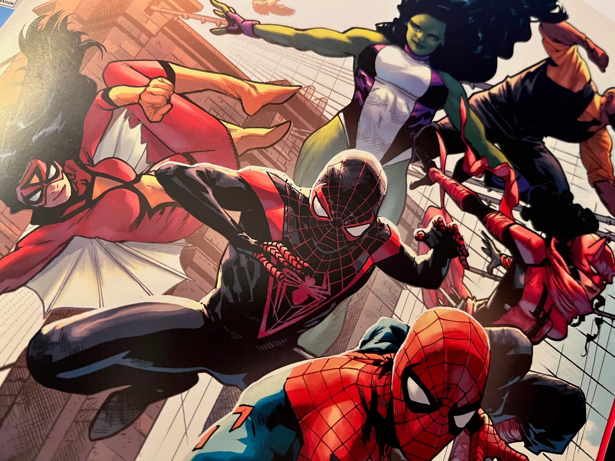 A detail of the cover of NYCC 2023 program cover, with art by Mahmud Asrar