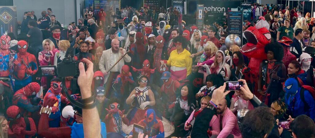 Many Spider-People pose at the cosplay pavilion at NYCC 2023