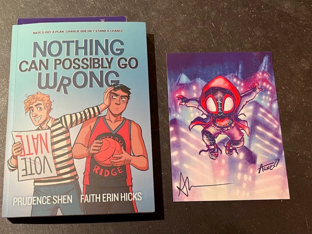 A book and signed print I purchased at NYCC 2023