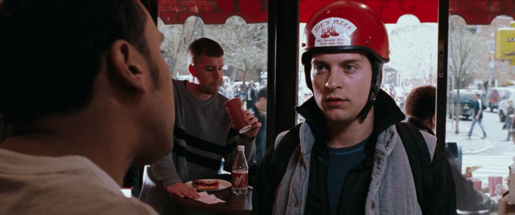 Still from Spider-Man 2 of Peter Parker delivering pizza