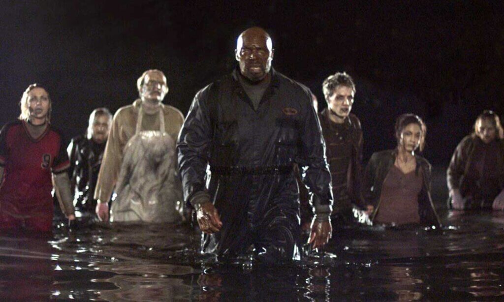 Still from the film Land of the Dead. Marching zombies emerge from the water.