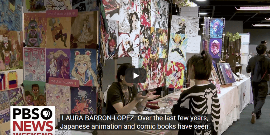 screenshot of PBS News segment depicting an artist's alley at an anime convention