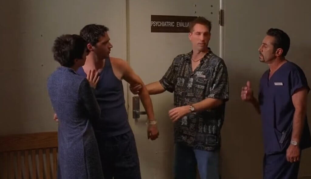 Scene from Day of the Dead 2: Contagium. Four people outside a psychiatric evaluation unit.