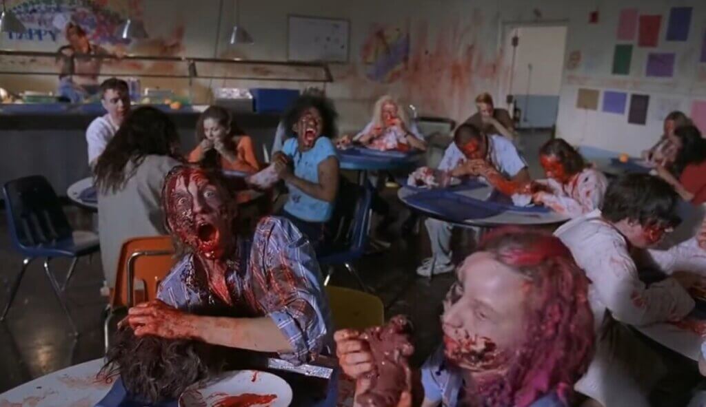 Scene from Day of the Dead 2: Contagium. Zombies eat human body parts in a cafeteria.