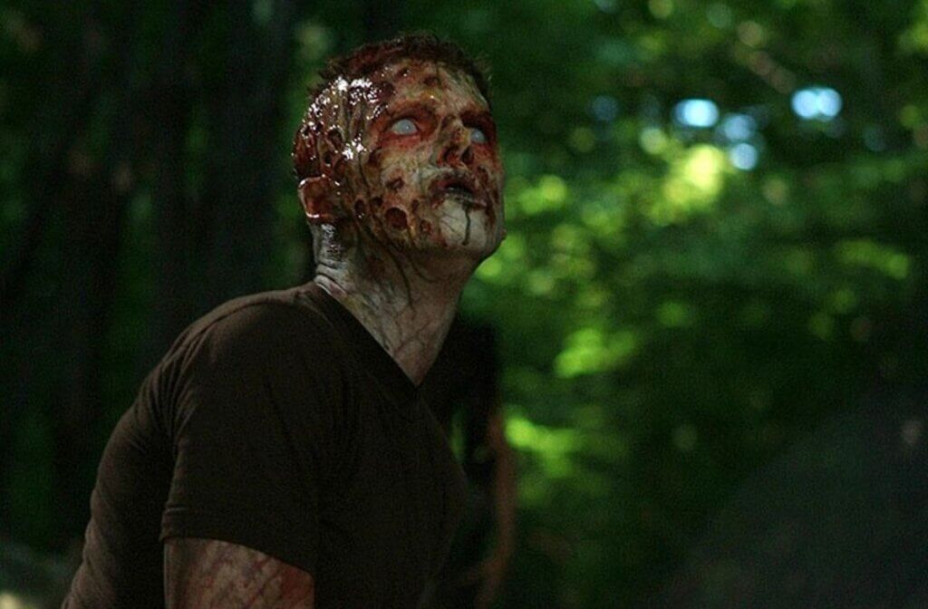Still from the 2008 film Day of the Dead, showing a rotting zombie.